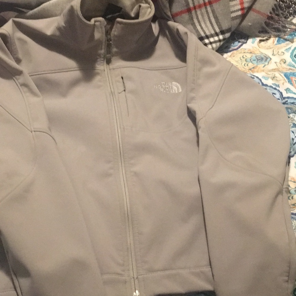 gray north face jacket fleeced lining